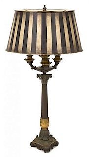 A French Empire Style Gilt and Patinated Bronze Lamp Height 27 1/2 inches.
