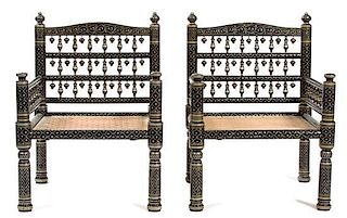 A Group of Four Indian Painted and Carved Wood Low Armchairs Height 32 inches.