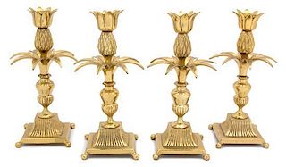 A Set of Twelve Brass Pineapple Candlesticks Height 9 inches.