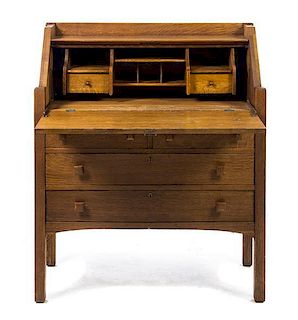 An Arts and Crafts Style Oak Bureau, Height 42 1/2 x width 35 3/4 x depth 15 1/2 inches.