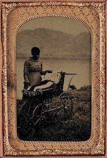 Cased Tintype Depicting a Female Slave with White Infant in a Baby Carriage, 19th century.
