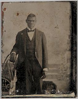 Booker T. Washington Tintype, standing, wearing a three-piece suit.