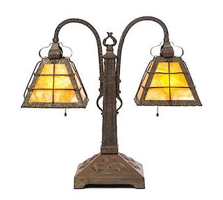 An Arts and Crafts Hammered Copper and Slag Glass Double Student Lamp, Height 19 1/2 x width 20 inches.