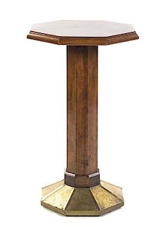 An Arts and Crafts Walnut Occasional Table, Height 32 x diameter 18 1/2 inches.