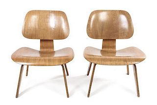 A Pair of Charles and Ray Eames Bentwood LCW Lounge Chairs, American (1907-1978), (1912-1988), Height 26 inches.
