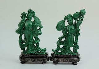 Two carved malachite figurines with wooden stands