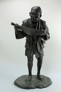 A finely detailed bronze figure of a Japanese man with