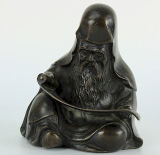 Japanese bronze figure of a Sage wearing robe, seated
