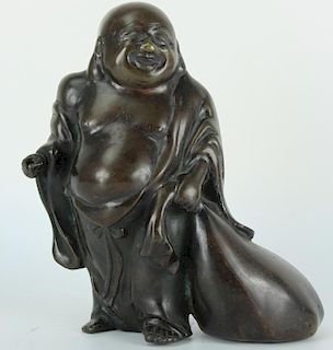 Japanese bronze figure of Hotei god dragging a bag