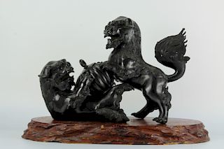 A pair of Japanese bronze figure of lions playing with
