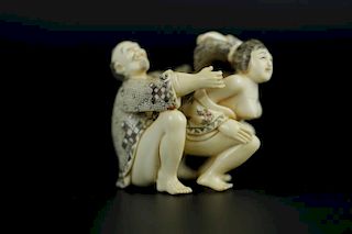 Vintage Netsuke carving of man and woman