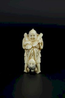 Vintage Netsuke carving of man and woman having oral