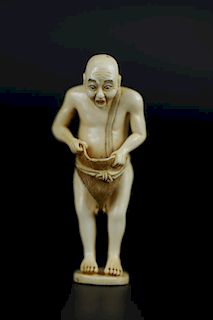 Vintage Netsuke carving of man surprised at his own