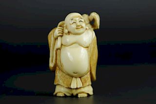 Vintage Netsuke carving of a Hotei god