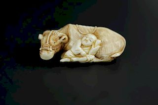 Vintage Netsuke carving of a boy and his ox
