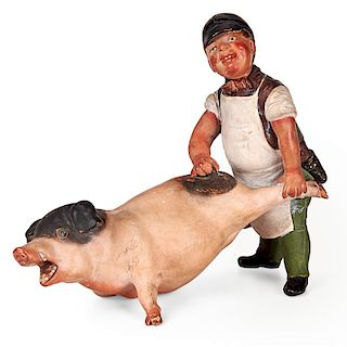 BUTCHER AND RELUCTANT PIG SCULPTURE