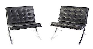 A Pair of Chromed Lounge Chairs, after the Mies van der Rohe example, Height 29 1/2 inches.