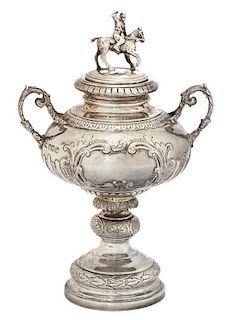 An English Silver Polo Two-Handle Trophy Cup, Mappin & Webb, Sheffield, 1900, the lid having a polo player on pony; raised on