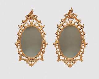 Pair of Chippendale Style Carved Giltwood Oval Wall Mirrors, Anthony R. J. Powell, signed and dated 1995