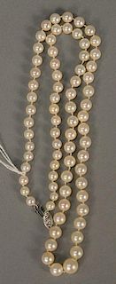 String of graduated pearls with white gold clasp, lg. 22in.