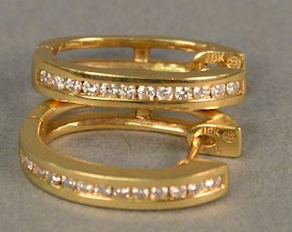 14K yellow gold and diamond channel set "huggie" earring, 5.8 grams.