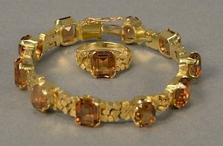 18K gold bracelet and ring set with alternating square and oval brown stones, 38.6 grams.