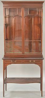 Mahogany inlaid stepback cabinet having two glass doors over two drawers. ht. 79 1/2in., wd. 35in., dp. 16 1/2in.