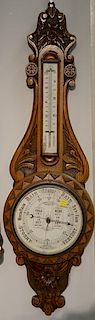 Carved oak Aneroid barometer. ht. 35in.