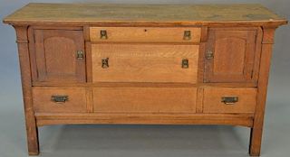 Mission oak sideboard having three drawers and two doors, Stickley style. ht. 37in., wd. 66in., dp. 23in. Provenance: Propert