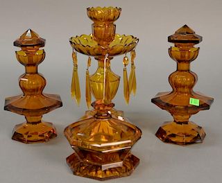 Four piece amber glass set, pair of crystal bottles (ht. 8in.)and jar marked Czechoslovakia, along with candlesticks with pri