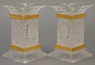 Pair of Lalique paquerettes candlesticks, each candle holder frosted and brass trimmed (minor imperfections), retail value $5