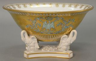 French porcelain center bowl, oval form gilt decorated with eagle and crown set on four swan unglazed porcelain base on plain