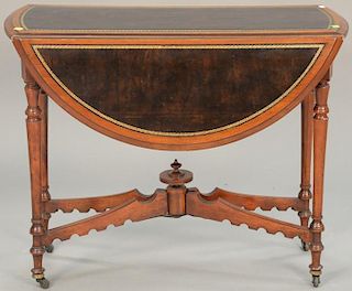 Gateleg drop leaf table with leather top (opens to round top). ht. 27 1/2in., top closed: 12" x 35"