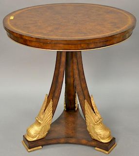 Maitland Smith round side table with dolphin head base. ht. 31in., dia. 30in.