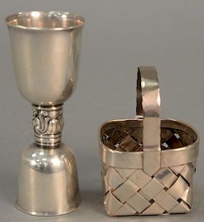 Two Cartier sterling silver pieces to include small basket marked Cartier handmade sterling (ht. 3in.) and a Cartier shot jig