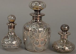 Three silver overlay cologne bottles. ht. 3in. to 5in.