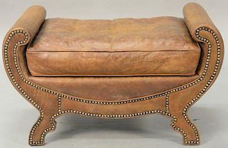 Custom leather upholstered ottoman. ht. 20in., wd. 33 1/2in.
