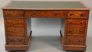 Three part mahogany knee hole desk having tooled leather top. ht. 29in., top: 27 1/2" x 54 1/2"