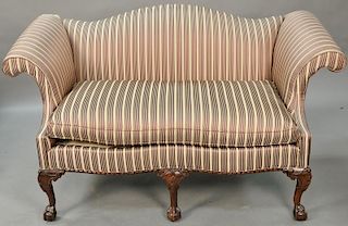 Chippendale style loveseat, upholstery torn top left side. lg. 62in.