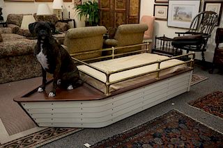 Contemporary boat shaped youth bed with brass rails. ht. 23in., lg. 86in., wd. 34in.