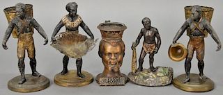 Five Blackamoor figures including pair of white metal toothpick holders, bronze bust of a man with striker, a figure holding 