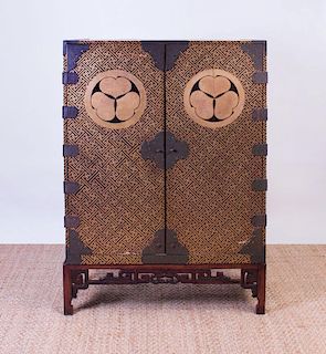 JAPANESE METAL-MOUNTED GILT AND BLACK LACQUER CABINET ON CHINESE HARDWOOD STAND