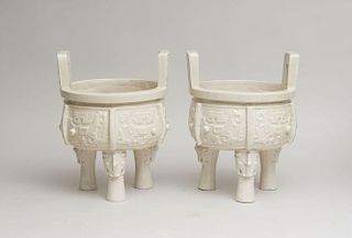PAIR OF CHINESE WHITE GLAZED 'DING'-FORM VESSELS