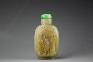 Chinese mutton fat jade snuff bottle with jadeite stopper glued to the bottle. Low relief carved figure of a man on horseback