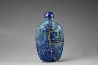 Chinese Lapis Lazuli snuff bottle with golden veins. Low relief carved figure of a lady seated beneath the tree of life with