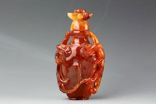 Chinese carved Cornelian snuff bottle with matching stopper. Open and deep relief carving of two foliage . 19th century