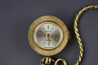 Vintage Doxa Turler swiss made gold pendant watch with gold chain. No movements