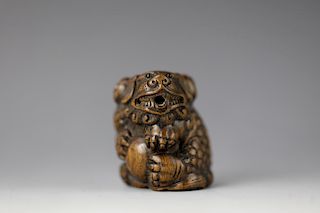 Vintage Netsuke carved hardwood foo dog lion with ball