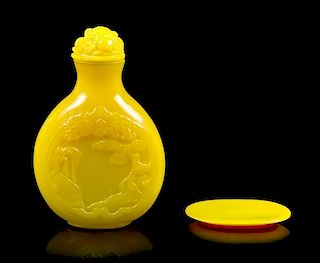 A Peking Glass Snuff Bottle and Snuff Dish, Height of bottle 2 3/8 inches.