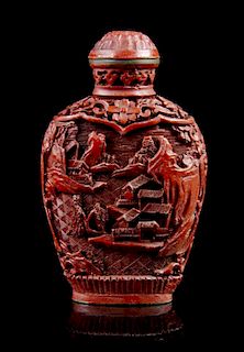 A Carved Cinnabar Lacquer Snuff Bottle, Height overall 3 inches.